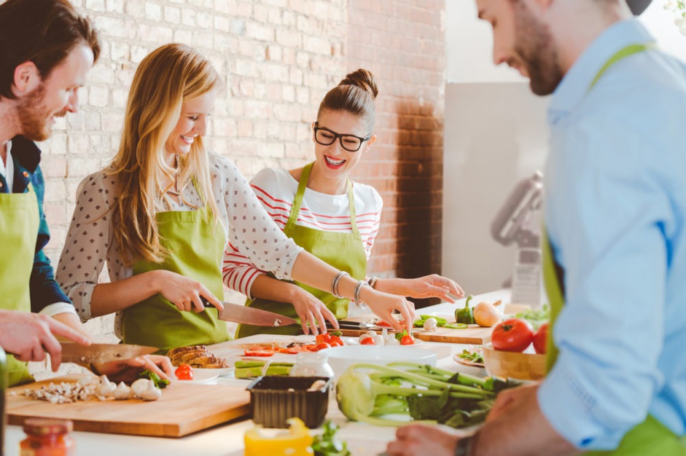 Four people taking part in cooking class